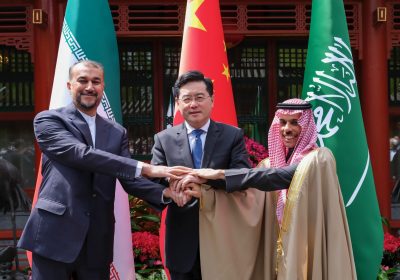 In this photo released by Xinhua News Agency, Iran's Foreign Minister Hossein Amirabdollahian, left, hold hands with his Saudi Arabian counterpart Prince Faisal bin Farhan Al Saud, right, and Chineses counterpart Qin Gang in Beijing Thursday, April 6, 2023. Long-time Mideast rivals Iran and Saudi Arabia took another significant step toward reconciliation Thursday, formally restoring diplomatic ties after a seven-year rift, affirming the need for regional stability and agreeing to pursue economic cooperation. (Ding Lin/Xinhua via AP)